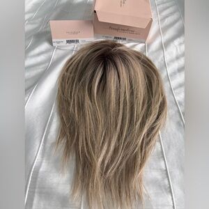 Raquel Welch heat resistant synthetic hair topper in Ash Blonde